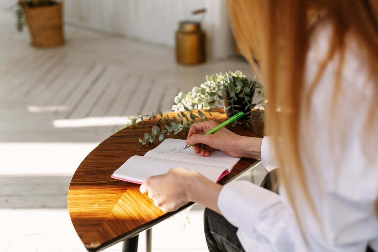 Person Writing in Journal